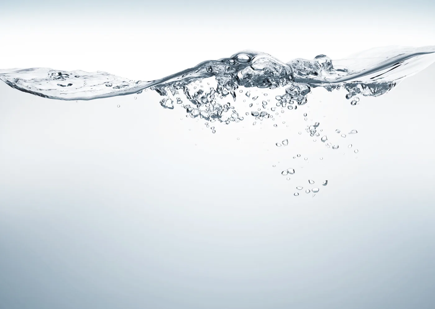Clear water splash with bubbles suspended on a white background, minimalist and clean, no text visible.